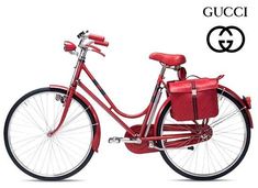 a red bicycle is shown with the words gucci on it