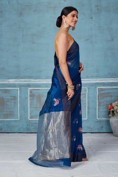 Elegant blue Pattu silk sari with zari border makes a perfect drape for special occasions. It is adorned with floral zari motifs and comes with a matching blouse piece. Disclaimer: The shown stitched blouse on the model is for display purpose only. The saree comes with a matching blouse piece and finished with fall and piko. Festive Blue Tussar Silk Pre-draped Saree, Blue Cotton Silk Dupatta For Transitional Season, Transitional Blue Cotton Silk Dupatta, Indigo Chanderi Traditional Wedding Wear, Indigo Chanderi Traditional Wear For Wedding, Blue Tussar Silk Pre-draped Saree With Dupatta, Traditional Blue Pre-draped Saree With Resham Embroidery, Festive Blue Art Silk Pre-draped Saree, Festive Indigo Traditional Wear With Cutdana