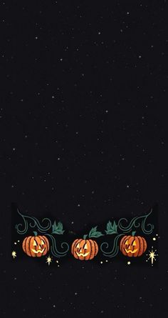 two carved pumpkins sitting on top of each other in front of a black background