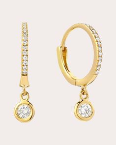 An elevated approach to traditional hoops, these huggie earrings decorate their 14-karat gold design with small channel-set diamonds. Larger bezel drops hang from the base to create head-turning shimmer. Hinge click closure 14k yellow gold and diamond Diamond carat: 0.17 ctw Polish with soft cloth Made in the USA Measurements Diameter: 0.43in Gold Diamond Hoop Earrings, Huggie Earrings Gold, Diamond Carat, Women Diamond, Huggie Earrings, Diamond Hoop Earrings, Channel Set, Gold Design, Huggies Earrings