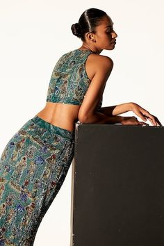 Green mermaid trail lehenga featuring embellished Egyptian motifs with jewel, sequin, and crystal work. Comes with a matching sleeveless blouse with a curved hem., Fit: Relaxed Glamorous Fitted Mirror Work Choli, Fitted Sharara With Sequins, Egyptian Pattern, Cape Lehenga, Kurta Lehenga, Lehenga Pattern, Green Mermaid, Lehenga Skirt, Hem Blouse