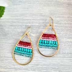 These super lightweight earrings have these gorgeous pop colors. Featuring in order 2mm garnets,  dark red seed miyuki beads 2.5mm rhodonites Pink miyuki beads 4mm turquoise rondelles Turquoise color seed beads 3.5mm apatite All wire wrapped in non tarnish gold wire on a brass teardrop finding and 14k goldfilled ear wires. If you have any questions please feel free to ask.  Anddd don't forget to follow me on instagram: @maddysgemstudio Thank you for stopping by! Bohemian 14k Gold Filled Earrings With Tiny Beads, Gift Teardrop Earrings With Colorful Beads, Beaded Teardrop Jewelry For Gifts, Bohemian Beaded 14k Gold Filled Earrings, Bohemian 14k Gold Filled Beaded Earrings, Bohemian 14k Gold Filled Beaded Dangle Earrings, Bohemian 14k Gold-filled Beaded Dangle Earrings, Bohemian 14k Gold-filled Jewelry With Colorful Beads, Teardrop Earrings Gift