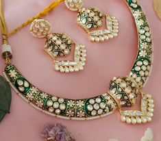 This is a Intrucate kundan hasli necklace.the meenakari is so detailed. Beautiful high end designer hasli necklace can be paired with your favorite outfit. Such a contemporary style can be pulled off with Indian as well as western wear.   Necklace Size - hasli  Earrings - kundan earrings Luxury Spiritual Meenakari Necklace, Festive Kundan Necklace With Meenakari For Designer Wear, Bollywood Designer Jewelry For Navratri, Designer Gold Jewelry For Navratri, Bollywood Style Jewelry With Zari Work For Designer Wear, Bollywood Style Designer Jewelry With Zari Work, Kundan Jewelry For Navratri Designer Wear, Navratri Kundan Designer Jewelry, Traditional Necklaces For Diwali Designer Wear