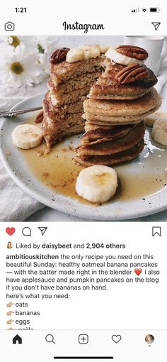 a plate topped with pancakes covered in banana slices