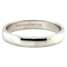 Tiffany & Co Forever Wedding Band Ring Mens 4.5mm Platinum Size 12.5 100% Authentic Tiffany & Co. Forever 4.5mm Band Original MSRP is $2,500 Check Out the Tiffany Hallmarks 4.5mm wide, properly hallmarked with the Tiffany & Co logo Original Tiffany Creation 4.5mm Band Flawlessly Crafted Platinum Reflects a Lifetime of Memories This Ring is Thick and Durable Perfect as Wedding or Anniversary Ring or as Gift For Any Occasion Like New Condition ***800***322***8700 Customer Care Your New Ring Will A Co Logo, Forever Wedding, Louis Comfort Tiffany, Ring Mens, Tiffany And Co, Wedding Band Ring, Anniversary Ring, Tiffany & Co., Anniversary Rings