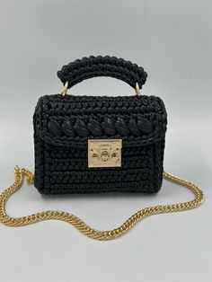 ELEGANT HIGH QUALITY BAGS 🛍️🛍️🛍️       Product Description:  ✨It is handcrafted with love using high-quality metallic yarn, giving it a unique and luxurious look. The black metallic color adds a touch of elegance and sophistication, making it perfect for both day and night occasions. ✨ The lining is carefully chosen to match the bag's color, adding a seamless finish to the overall design. ✨ It sits comfortably on your shoulder and adds a touch of glamour to any outfit. Whether you're heading Luxury Black Crochet Top Handle Bag, Luxury Black Crochet Bag With Top Handle, Elegant Black Crochet Top Handle Bag, Elegant Black Woven Crochet Bag, Elegant Black Handwoven Crochet Bag, Luxury Black Crochet Bag For Daily Use, Handmade Black Crochet Bag With Top Handle, Black Handmade Crochet Bag For Gift, Handmade Black Crochet Bag As A Gift