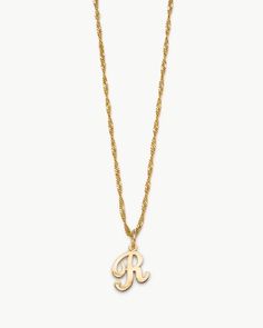 Your initial thought should be adding this sweet + swirly sentiment to your collection, ASAP. Rep yourself or a lover alike with this pretty script letter hung on our sparkly Valerie Chain. The Cursive Initial Necklace is a timeless piece that not only fits seamlessly with your daily stack but is one you can keep forev Jewelry Tour, Cursive R, R Necklace, Gold Initial Pendant, Wishlist 2024, Wednesdays We Wear Pink, Script Lettering, Gold Initial, Jewellery Ideas