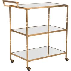 a gold metal and glass serving cart with three shelves on wheels, one shelf holding two glasses