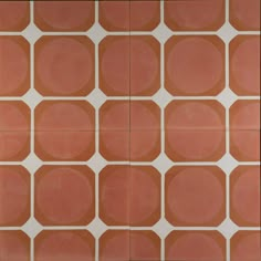 an orange and white tiled wall with circles on it