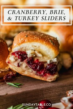 cranberry, brie and turkey sliders on a cutting board with text overlay