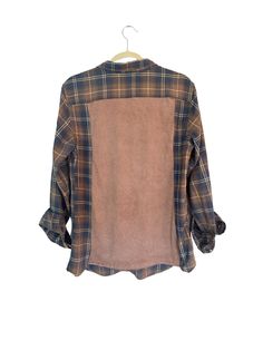 Elevate your wardrobe with this one-of-a-kind upcycled flannel that is fully customizable. Have a favorite singer? favorite band? favorite sports team? We will work together to come up with the perfect design for the back of this shirt.  Each flannel is carefully selected and paired with a t-shirt, creating a distinctive look that can't be found anywhere else. Made from high-quality, pre-loved materials, this flannel is soft and comfortable for all-day wear. Embrace sustainable fashion by choosing upcycled clothing that reduces waste and promotes a greener planet. Ideal for casual outings, concerts, or layering in cooler weather, this versatile flannel pairs well with jeans, leggings, or your favorite skirt. Each piece is meticulously handcrafted to ensure durability and a flawless finish. Plaid Patchwork Flannel Shirt For Fall, Patchwork Long Sleeve Flannel Shirt, Laundry Floor, Upcycled Flannel, Dryer Sheets, Upcycled Clothing, Jeans Leggings, Cooler Weather, Upcycle Clothes