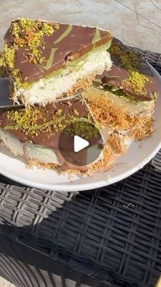 a white plate topped with pieces of cake on top of a wicker tablecloth