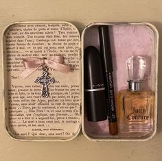 an open box containing cosmetics and perfume bottles