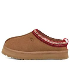 The Tazz clog features a playful UGGbraid detail and a platform outsole for a lifted vibe. Its ultra-soft UGGplush™ lining and insole provide moisture-wicking comfort. Made with sustainable materials, including recycled polyester and upcycled wool, the Tazz is a stylish and comfortable choice. Ugh Tazz Slipper, Tazz Ugg, Tan Uggs, Tazz Slipper, Shoes List, Ugg Tazz, Chestnut Uggs, Ugg Tasman Slippers, Ugg Tasman