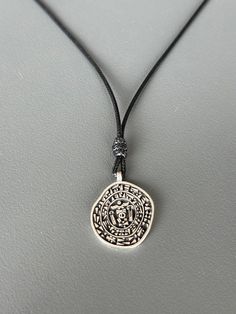 The Hittite royal seal was a privileged item belonging to kings, queens, and sometimes princes, representing the power and strength of its owner. The symbols formed in the hieroglyphs and cuneiform writings on the seal represent health and long life. All our artisan crafted products are made from 925 sterling silver which requires polishing from time to time from oxidation. You can quickly restore silver to shine with a polishing cloth Please; Avoid contact with cosmetics and chemicals. Don't wear it in the shower, pool, spa, or the beach. Stamp Necklace, Amulet Charm, Stamped Necklaces, Artisan Craft, Locket Necklace, Long Life, Locket, Charm Pendant, Prince