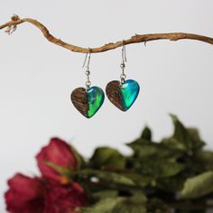 "These unique opal dangle earrings are made by combining iridescent opal with glass-like resin and oak wood.  The opal has a subtle color change and includes all of the colors of the rainbow.  These boho heart earrings make a great gift for mom, bridesmaid gift, or simply a gift to treat yourself.  D E T A I L S * Made to order opal dangle earrings * Materials: precious burl wood, lab grown opal and resin * Different opal colors and multiple hook materials to choose from * Shipped in a beautiful Unique Heart Drop Earrings As Gift, Heart-shaped Green Jewelry With Matching Earrings, Dangle Heart Earrings As Gift, Unique Heart-shaped Earrings, Handmade Heart-shaped Earrings For Her, Handmade Heart-shaped Earrings As A Gift For Her, Unique Heart-shaped Earrings For Valentine's Day, Hearts Earrings, Wood Resin Jewelry