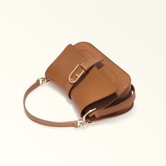 Furla Flow Chic Brown Saddle Bag With Metal Hardware, Chic Leather Crossbody Bag, Chic Rectangular Baguette Bag With Metal Hardware, Chic Formal Baguette Bag With Detachable Strap, Luxury Baguette Bag With Metal Hardware For Everyday Use, Formal Leather Baguette Bag With Magnetic Closure, Chic Baguette Clutch With Detachable Strap, Elegant Calf Leather Bag With Adjustable Strap, Elegant Saddle Shoulder Bag With Metal Hardware