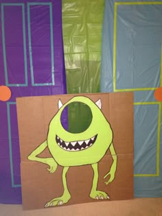 there is a cardboard monster on the wall