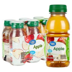 several bottles of apple juice are shown in this image