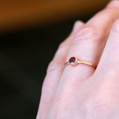 A gorgeous, rose-hued Rhodolite Garnet gemstone is handset entirely in 14k yellow gold. The bezel that holds the garnet stone is integrated right into the band, which I hammer for a sparkling, faceted finish. Rhodolite garnet has a much more raspberry tone than traditional garnet, and it is absolutely stunning paired with yellow gold. The gold I use is recycled and refined in the U.S. by an award-winning facility. This ring is made to order for you in your requested ring size. The garnet gemston Garnet Birthstone Ring In Yellow Gold, Rose Gold Bezel Set Ruby Ring In 14k Gold, Garnet Ring Gold, Hammered Band, Gold Diamond Earrings, Garnet Ring, Garnet Stone, Rhodolite Garnet, Large Ring