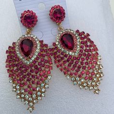 Glamorous Pink Jeweled Jewelry, Glamorous Pink Jewelry For Celebration, Pink Dangle Chandelier Earrings For Wedding, Pink Jeweled Crystal Dangle Earrings, Pink Dangle Bridal Earrings For Pierced Ears, Pink Jeweled Wedding Earrings, Pink Crystal Earrings For Pierced Ears, Pink Rhinestone Chandelier Earrings For Party, Pink Chandelier Earrings With Rhinestones For Party