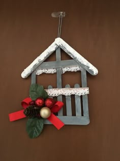 a birdhouse made out of popsicle sticks and wood