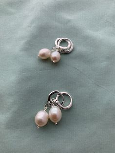 "Creamy light creamy white, natural 1) Very Small or 2) Small teardrop oval real pearls and mounted on lovely period appropriate loops in 16k gold or silver plated brass loops: great soft close, stay on well and great for sensitive ears (lead free, nickel free). These small real pearl earrings were inspired by the pair that British royalty wear on a regular basis! THIS LISTING is a CUSTOMER FAVORITE! MEASUREMENTS: Earrings measure about 1\" long VERY SMALL: 7.2 X 8.3mm pearl SMALL: 7.8 X 10.3mm Cream Pearl Drop Jewelry, Teardrop Hoop Earrings With Pearl Pendant, Teardrop Hoop Earrings With Pearl Pendant As Gift, Silver Teardrop Hoop Earrings With Pearl Charm, Delicate Cream Jewelry With Pearl Drop, Delicate Cream Pearl Drop Jewelry, Cream Pearl Drop Jewelry For Anniversary, Silver Teardrop Pearl Hoop Earrings, Silver Hoop Earrings With Pearl Drop