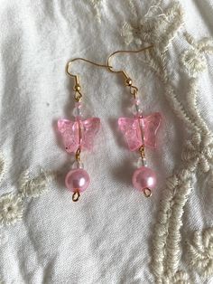 Pink Pearl Butterfly Earrings 🤍 Handmade ready to wear earrings 🤍 free shipping! 🤍 Comes with organza gift bag 🤍 Nickel Free Hooks! 🤍 Shipping time: 2-3 weeks 🤍 Earring length 2 inches Butterfly Bead Earrings, Diy Cute Earrings, Cute Earrings Handmade, Pink Dangle Crystal Earrings For Gift, Trendy Beaded Earrings For Gift, Hypoallergenic Earrings For Summer Party, Pink Pierced Earrings As Gift, Dainty Pink Earrings For Party, Dainty Pink Party Earrings