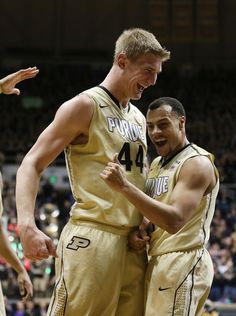 two basketball players are congratulating each other on the court