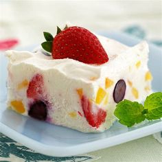 a piece of cake with fruit on top