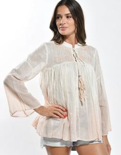 White bohemian embroidered top with lurex woven in for extra dreamy styling. Paired here with our Feeling Peachy ultra wide leg high waist pants. Spring Bohemian Blouse With Boho Collar, Chic Embroidered Tops With Relaxed Fit, Chic Embroidered Relaxed Fit Tops, Beige Bohemian Peasant Top For Beach, Beige Bohemian Peasant Top For Vacation, Casual Embroidered Top For Spring, Bohemian Relaxed Fit Top For Brunch, Bohemian Style Relaxed Fit Blouse For Spring, Bohemian Flowy Embroidered Top With Floral Design