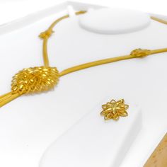 This Iconic Radiant 22k Gold Set, weighing 31.3 grams, is a splendid showcase of classic elegance and timeless design. Crafted with 22k gold, it boasts a brilliant yellow gold finish that enhances its overall appeal. The necklace, measuring 18 inches, features a drop length of 3.25 inches and is secured with a lobster ring lock for a comfortable fit. Accompanying the necklace are matching earrings, each 0.75 inches in length, equipped with push-back posts for easy wear. Ideal for those who appre 22k Yellow Gold Hallmarked Temple Necklace, Classic Yellow Gold Necklaces For Ceremonial Occasions, Classic Yellow Gold Ceremonial Necklaces, Classic Yellow Gold Necklace For Ceremonial Occasions, Formal Gold Temple Necklace With Elegant Design, Gold Temple Necklace With Elegant Design For Formal Occasions, Classic Yellow Gold Ceremonial Necklace, Luxury 22k Gold Yellow Jewelry, Gold-plated Temple Necklace With Elegant Design