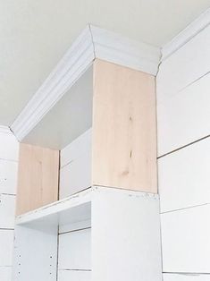 the corner of a room with white painted wood