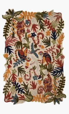 an old rug with animals on it and leaves around the edges, all in different colors