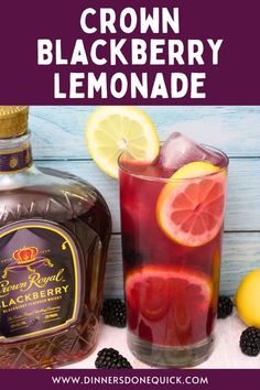 a bottle of crown blackberry lemonade next to a glass filled with blackberries