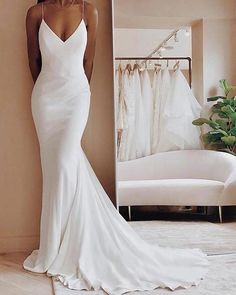 a woman standing in front of a mirror wearing a white wedding dress with spaghetti straps