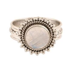 Elusive glimmers of color flash from a rainbow moonstone cabochon on this ring from Rakesh Rana in India. The stone is set in sterling silver on a band that is circled by a slender chain. The ring's bezel is elaborated with silver granules and a rope motif. Formal Silver Moonstone Cabochon Ring, Bohemian Cabochon Moonstone Ring, Bohemian Silver Oval Cabochon Moonstone Ring, Bohemian Nickel-free Round Moonstone Ring, Bohemian Silver Moonstone Cabochon Ring, Moonstone Cabochon, Chain Ring, Silver Jewellery, Cocktail Ring