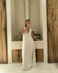 A favorite that’s sold out three times, the Gili Dress in beige check is the perfect balance between effortless style and all-day comfort. This breezy, lined maxi easily transforms from a laid-back beach cover-up to a chic evening look. With a dual neckline that lets you choose between a v-neck and high-neck, it offers styling possibilities for any occasion. Crafted from soft, breathable cotton, it’s your go-to for tropical vacations, summer nights out, and everything in between. Size & Fit: Rel Coastal Boho Fashion, Sac Diy, Tropical Vacations, Get Ready For Summer, Dress Beige, Summer Maxi, Summer Maxi Dress, Dress Outfit, Brown Beige