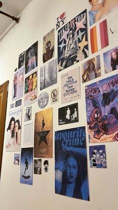 there are many posters on the wall