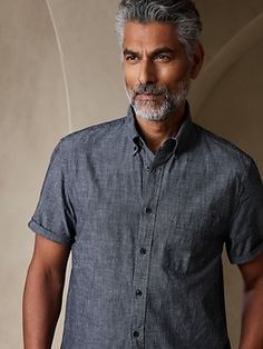 The quintessential chambray shirt, this all-year favorite shirt is crafted in our 100% cotton chambray that is specially washed for added softness.  UNTUCKED: Specially cut 1" shorter through the body for an untucked fit that still looks sharp.  Butt Untucked Dress Shirt Men, Casual Wedding Attire For Men, Dressy Casual Wedding Attire, Dressy Casual Dress Code, Chambray Shirt Outfit, Dressy Casual Attire, Dressy Casual Wedding, Chambray Shirt Outfits, Wedding Attire For Men