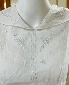 "This period piece white cotton ladies dress is just amazing -- it dates from 1800s or early 1900s -- and in amazing condition.  It's so beautiful and so feminine like many period piece ladies clothes. A different era indeed!  Despite being an Edwardian / Victorian / Regency eras garment, it's still a very wearable design style today. Classic!  The dress closes in the front with hook & eye closures.  The bodice and collar have exquisite white on white floral embroidery.  The long skirt has three panel borders of lace. The skirt isn't poofy but has volume so the wearer can comfortably walk and move in it.  For a historical garment, this is still quite a wearable piece. It's somewhat sheer so please consider underthings when calculating fit on you.  It would also be lovely as a home / shop d Elegant Cotton Victorian Dress With Historical Design, Elegant Victorian Dress With Historical Design In Cotton, Vintage White Victorian Dress For Spring, Spring Vintage White Victorian Dress, Elegant White Cotton Victorian Dress, Vintage Cotton Dress With Historical Design, Victorian Vintage Dress In Vintage White For Daywear, White Vintage Dress With Historical Design, Classic White Cotton Victorian Dress