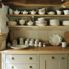 an old fashioned china cabinet filled with dishes