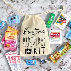 a birthday survival kit is laid out on a marble counter