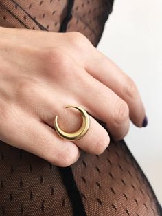 This ring is a piece from Keras collection.Sculptured and casted in solid sterling silver 925 and then double gold plated with 22k gold.Very nice and important weight. The crescent is 20mm (0.787 inch) All of my jewelry is handmade please allow for small variances from piece to piece ,as this is a feature of owning one of a kind original handmade jewelry. Feel free to ask me for personal orders . -22k gold platted Sterling silver 925 You may also like on bright silver https://www.etsy.com/listin Elegant Crescent Moon Charm Rings, Handmade Gold Moon Shaped Ring, Handmade Moon-shaped Gold Ring, Gold Sterling Silver Ring With Moon Charm, Gold Moon Charm Promise Ring, Celestial Style Open Ring With Moon Charm, Mystical Gold Round Rings, Gold Promise Ring With Moon Charm, Celestial Gold Crescent Rings