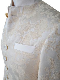 Ivory & Gold Designer Floral Fabric Made In Italy Signature Mandani Collar Single Button Closure Soft, natural shoulder construction Chest Barchetta Pocket Dual Vents Mother of Pearl with Gold Rim Buttons Luxury Jacquard Fabric Made In Italy Includes a Sebastian Cruz Couture Pocket Square of your choice! All of our jackets are made with 4" extra of fabric to ensure you don't have to send it back to us if it's too small or too big. You can tailor your jacket 2 sizes bigger and/or smaller if neede