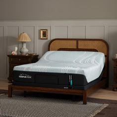 the tempur - pedic mattress is on display in a room with two nightstands