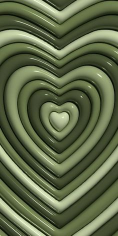 a heart shaped object in the middle of a green background