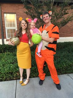 a man and woman dressed up as winnie the pooh and tigger for halloween