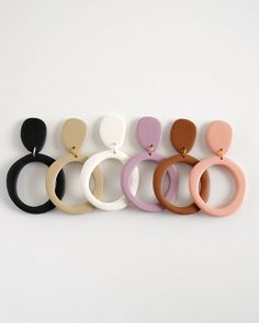 six pairs of wooden earrings in different colors