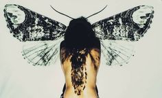 the back of a woman's body with an insect on her chest and wings